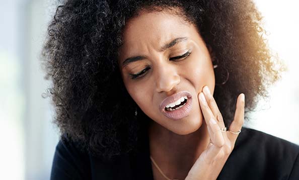 Woman experiencing tooth pain